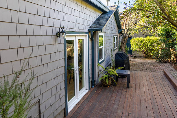 photo of a modern renovated custom ADU builders (Accessory Dwelling Unit) with wooden shingle walls in a garden setting in Austin TX